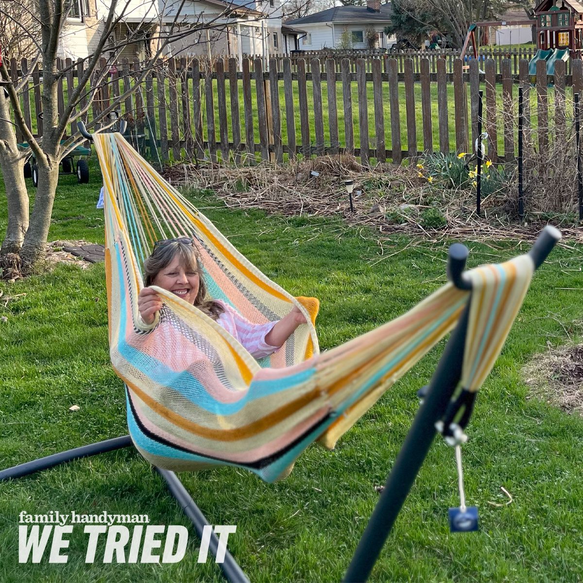 woman in a Yellow Leaf Hammock in a grassy backyard