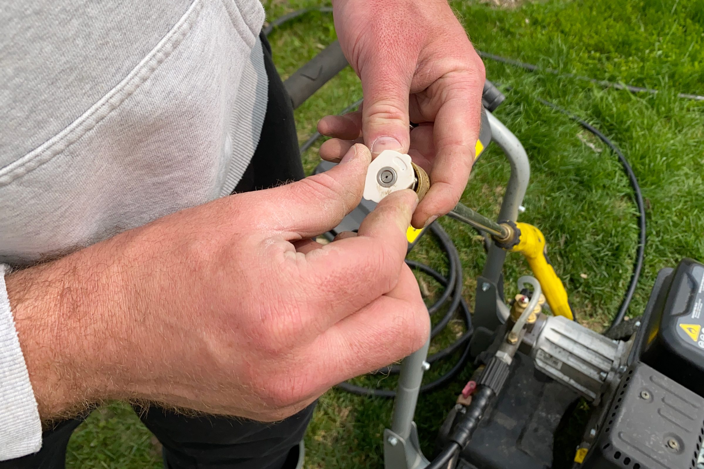 pressure washer nozzle in hands