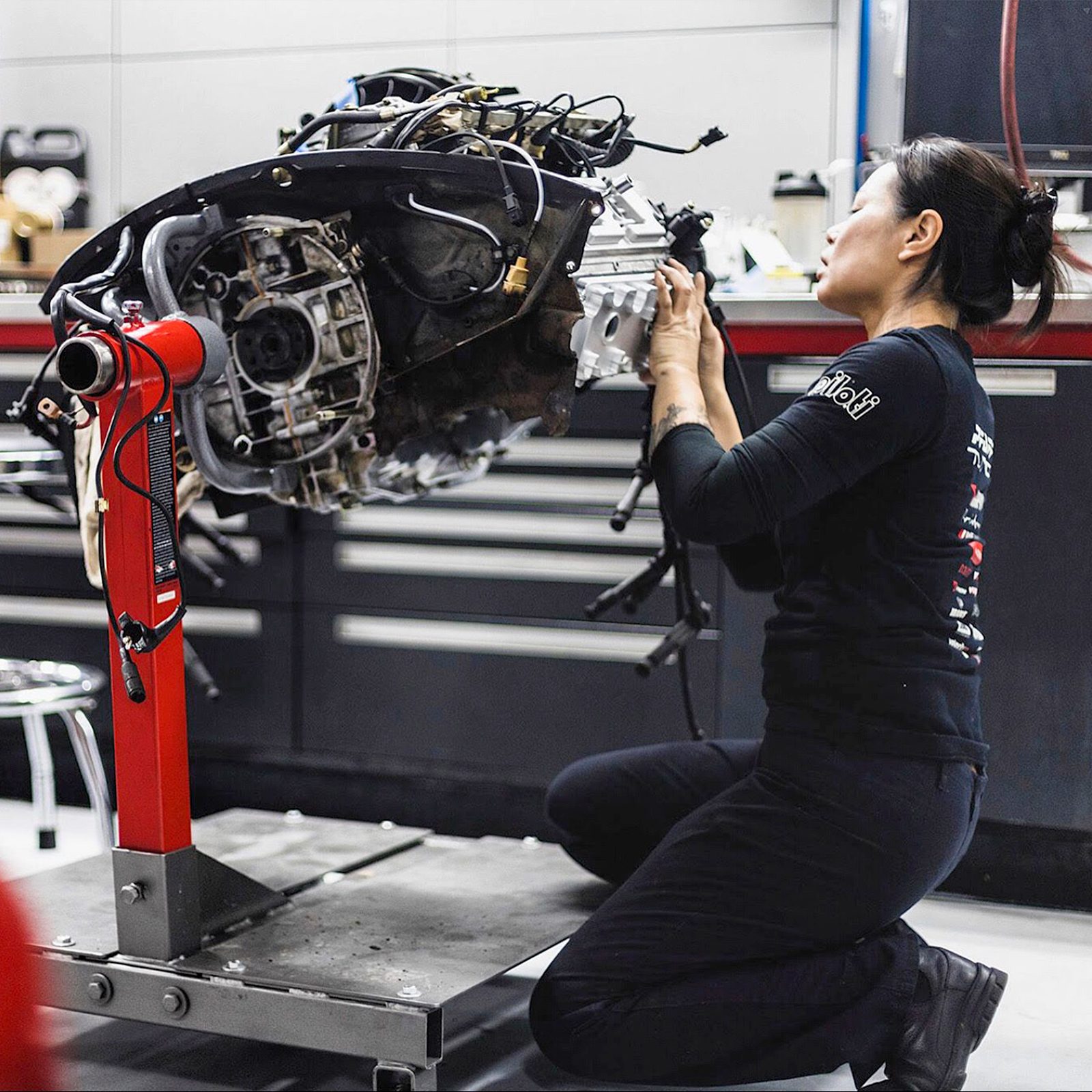 Nhu Nguyen working on restoring a car