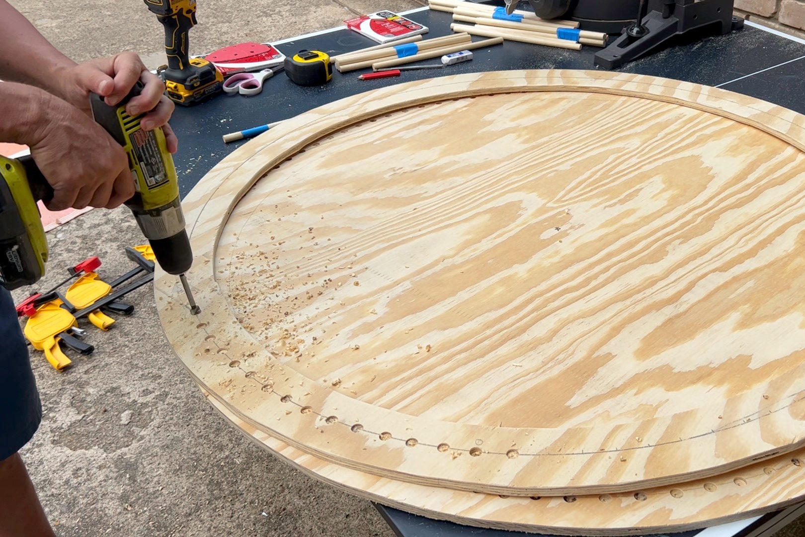 drilling holes in plywood circle around the edges