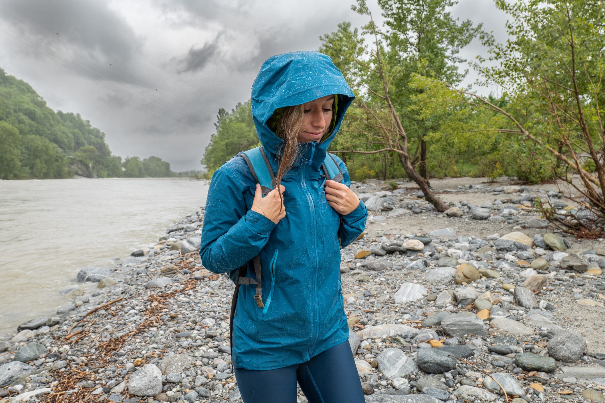 Hiker female under torrential rain