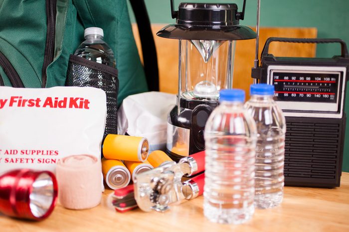 Emergency Preparedness Natural Disaster Supplies including Water, Flashlight, Lantern, Batteries and a radio