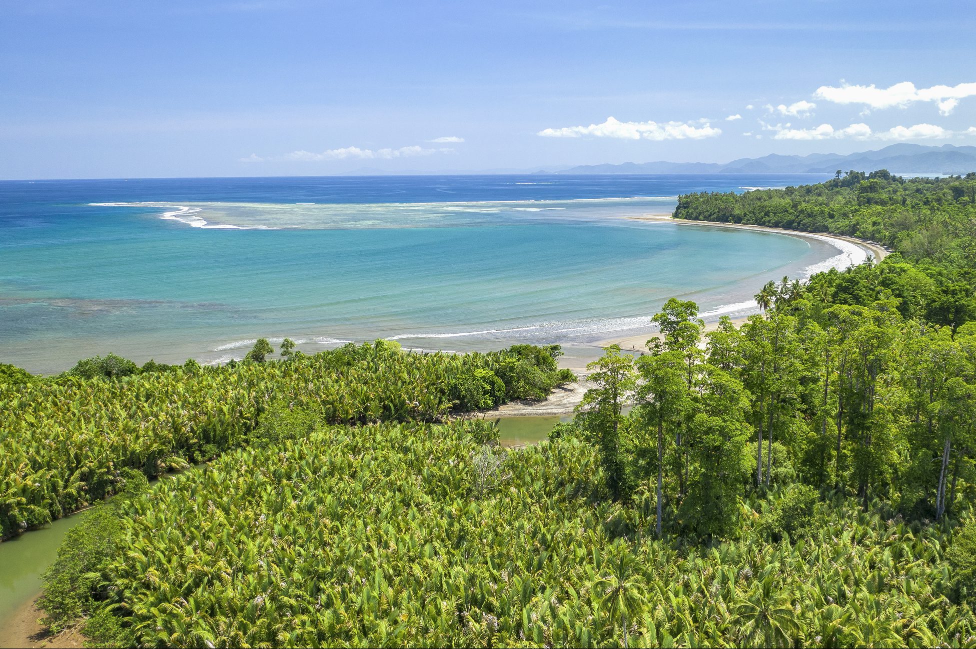 Bright sunny day showing a bay and creek in the north-eastern coastline of Choiseul island, Solomon Islands.