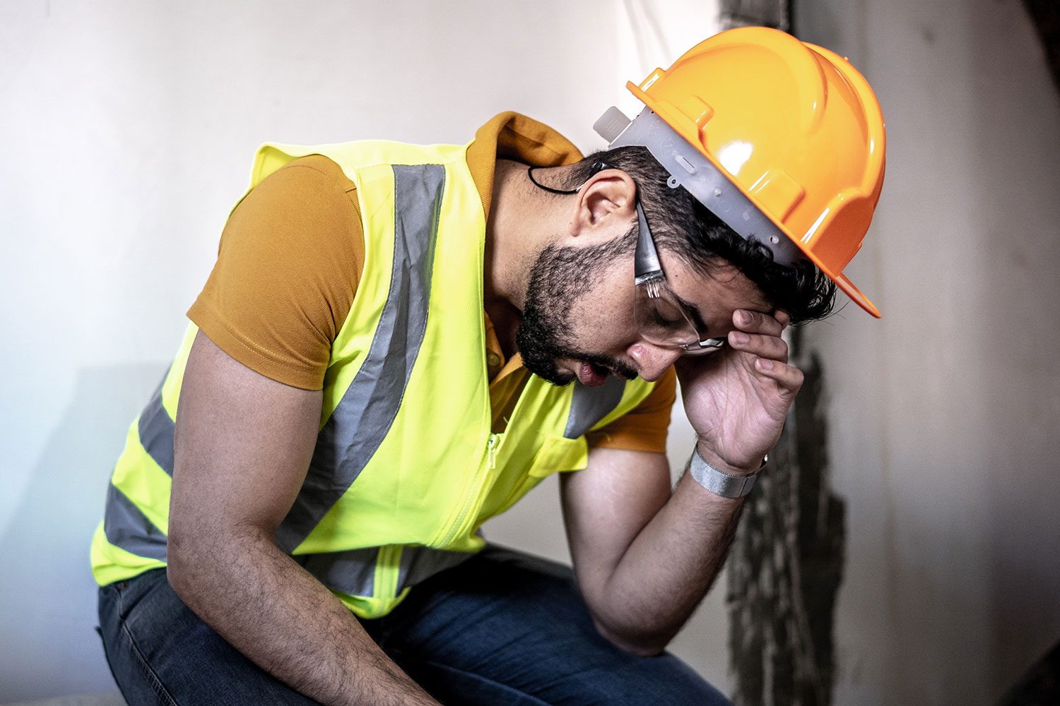 Exhausted Construction Worker At Construction Site