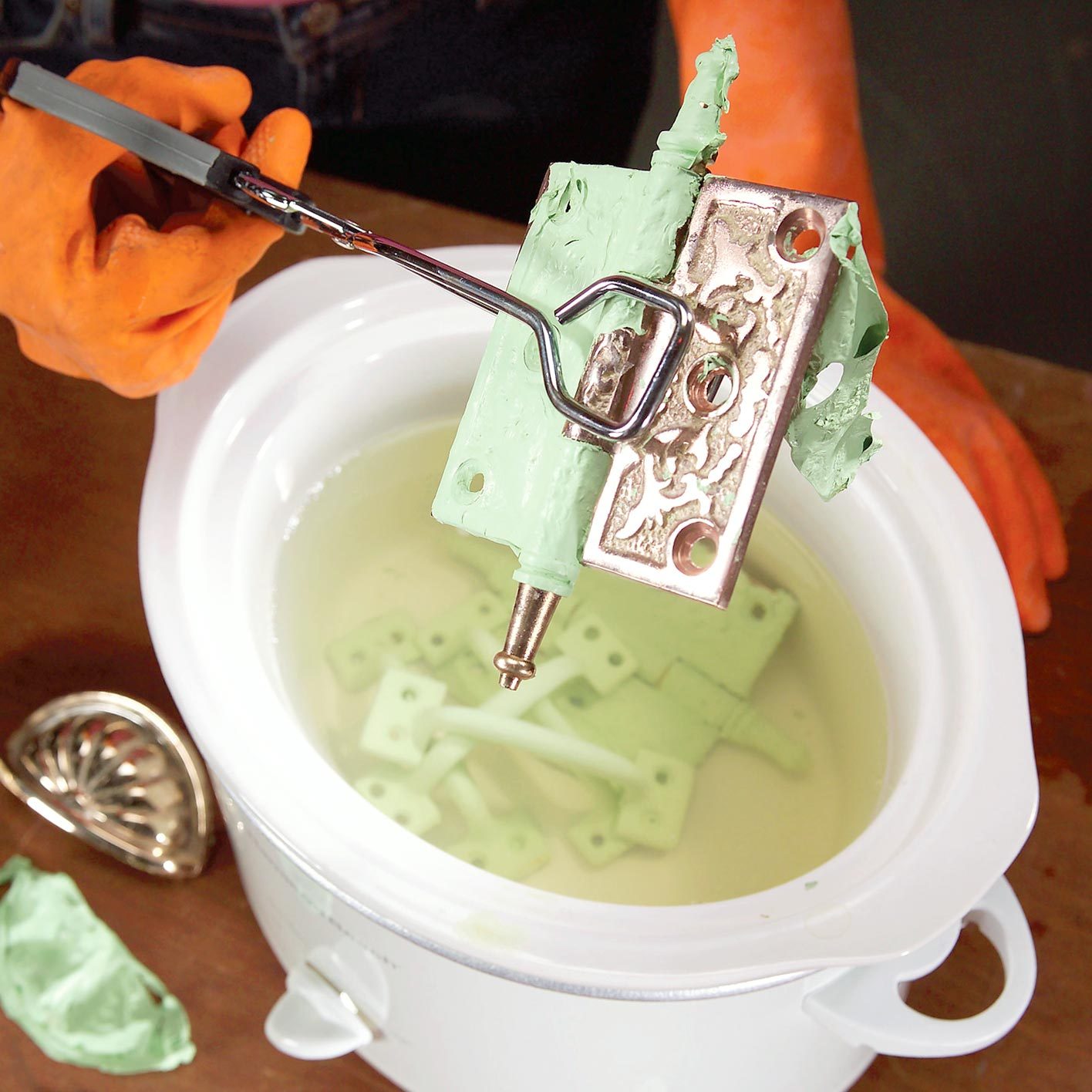 painted hardware in a crock pot