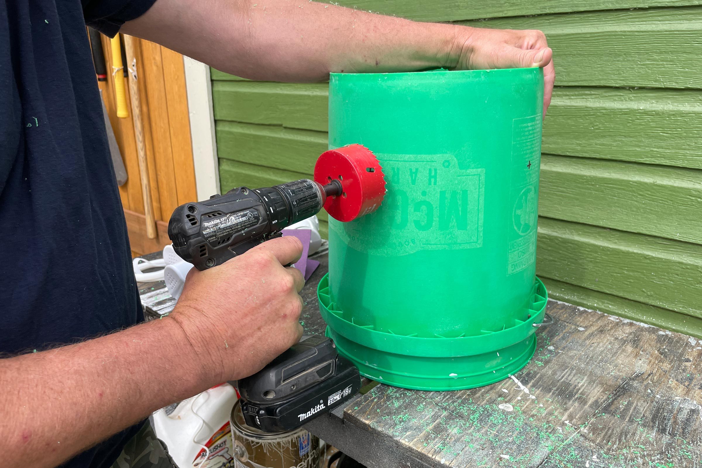 drilling holes in bucket