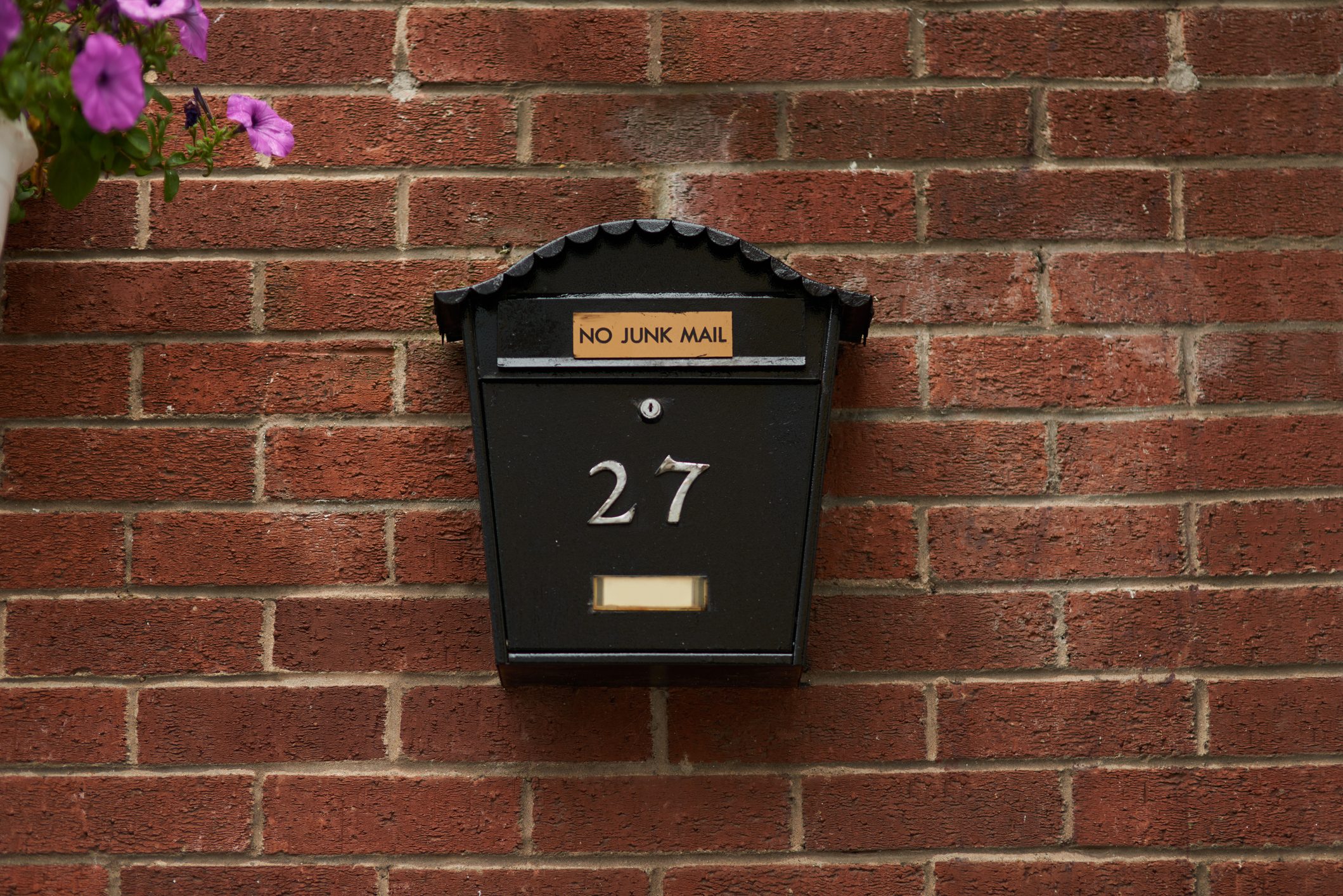 secure Mounted mailbox on a brick wall