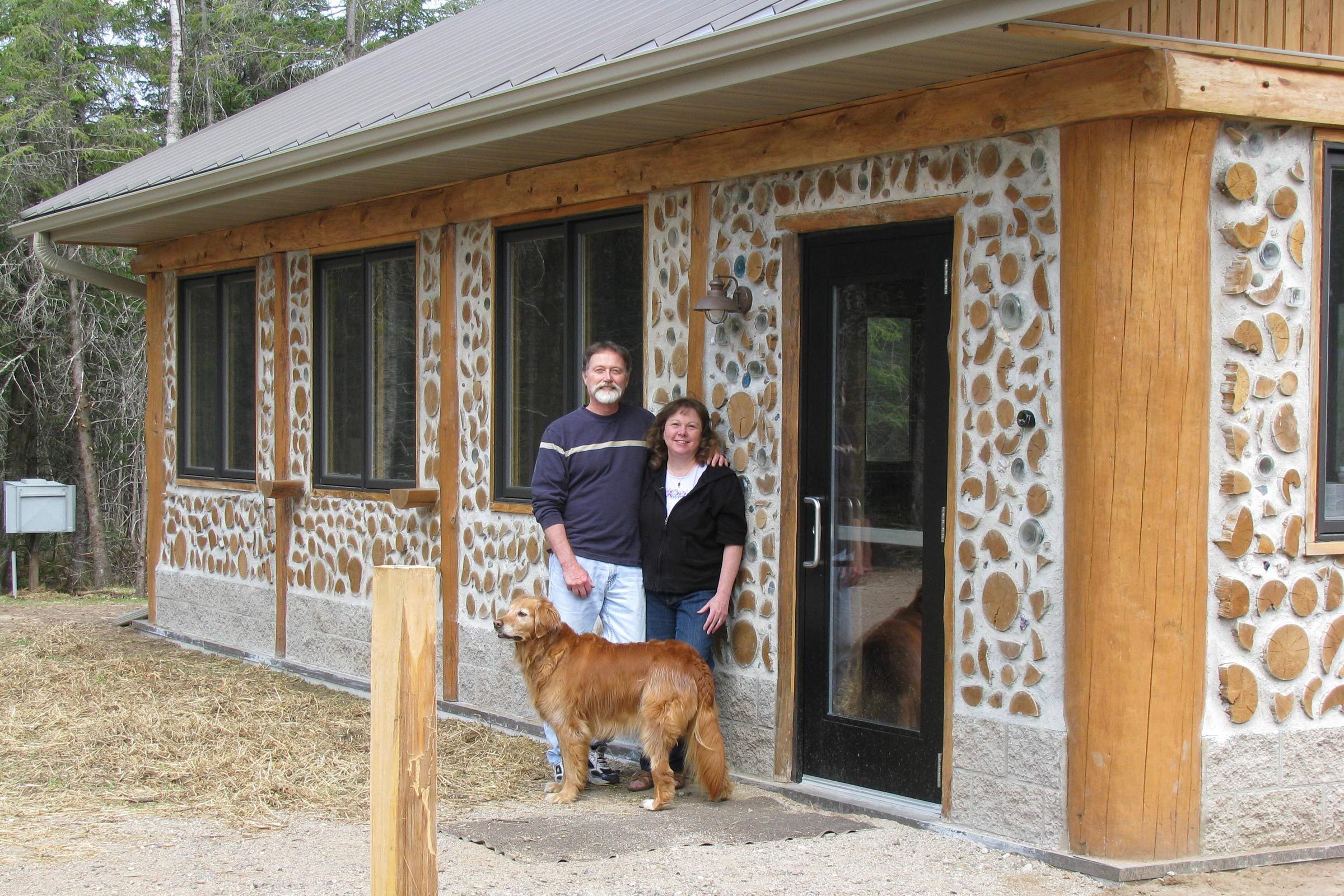 Rich, Becky and their dog at the Cordwood Classroom