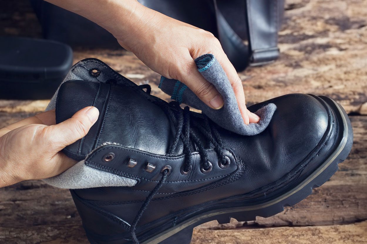 Cleaning Shoes On Wooden Background