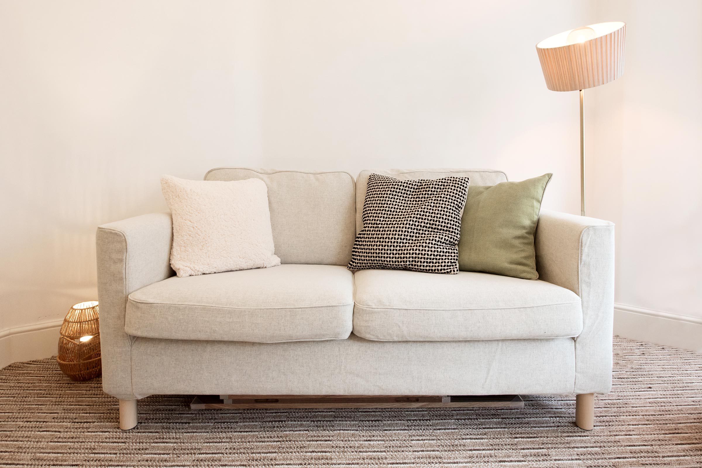 couch with pillows in living room