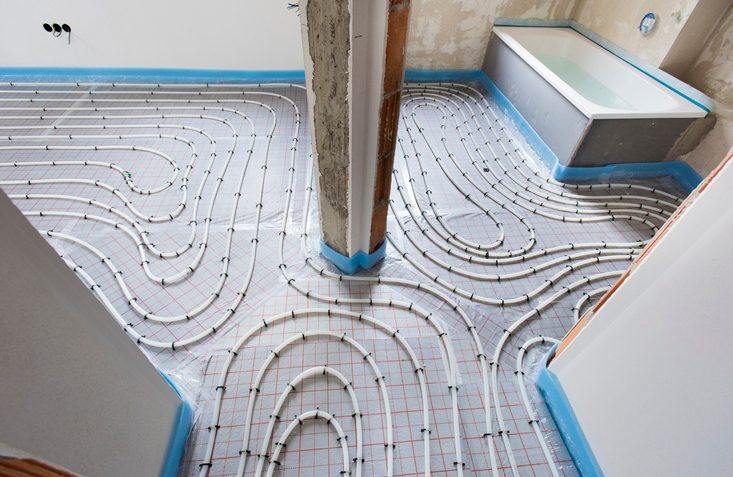 pipes of under floor heating in construction of new residential house