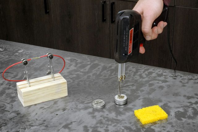 Heating up the soldering gun