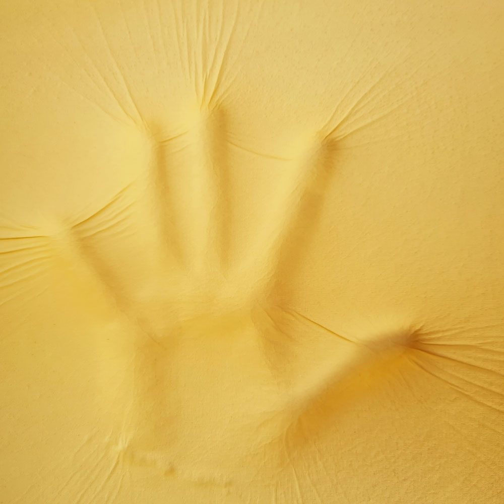 Handprint On A Memory Foam Pillow