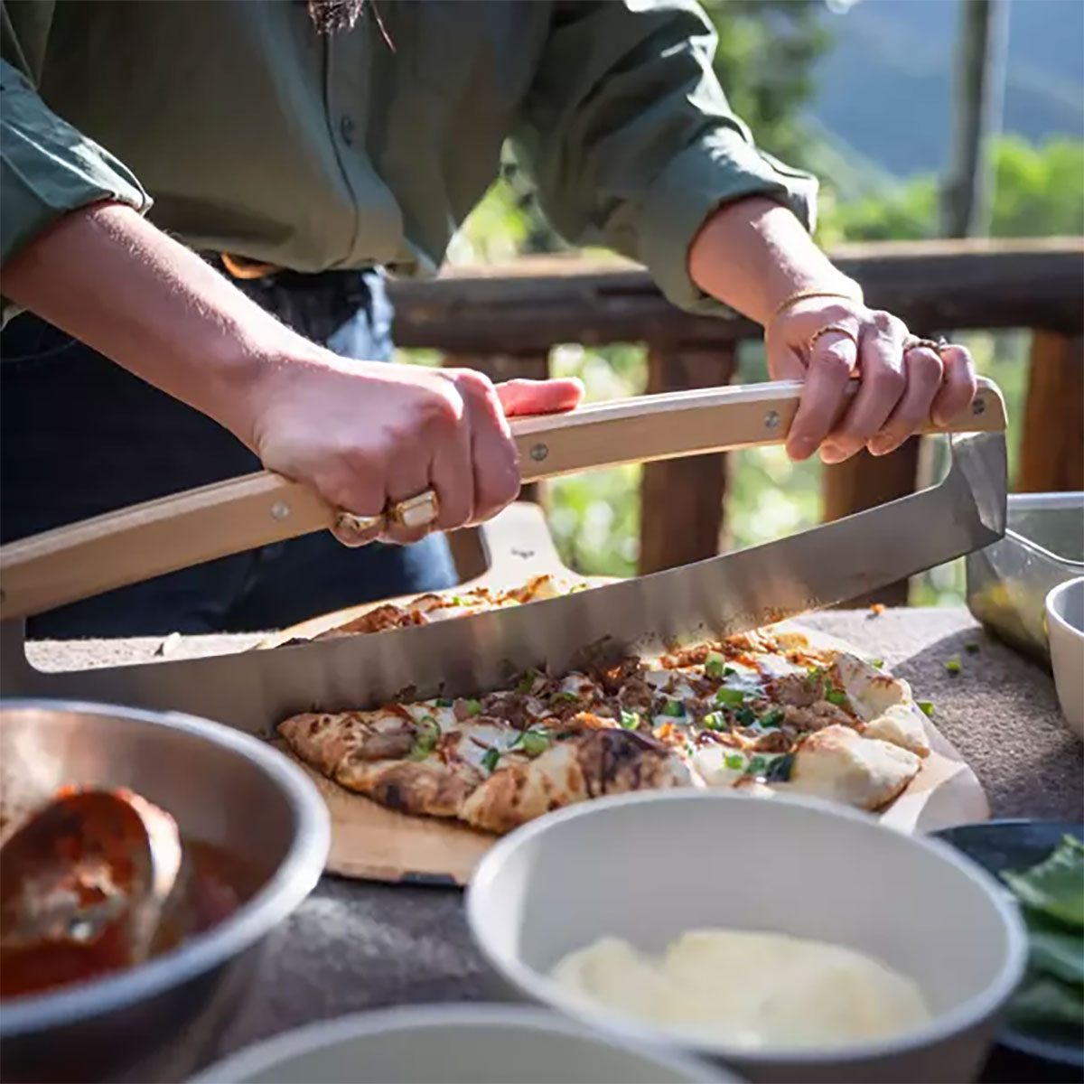 Cutting pizza with pizza cutter