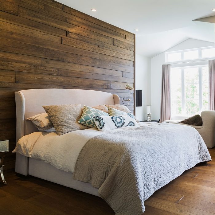 Wooden wall behind bed