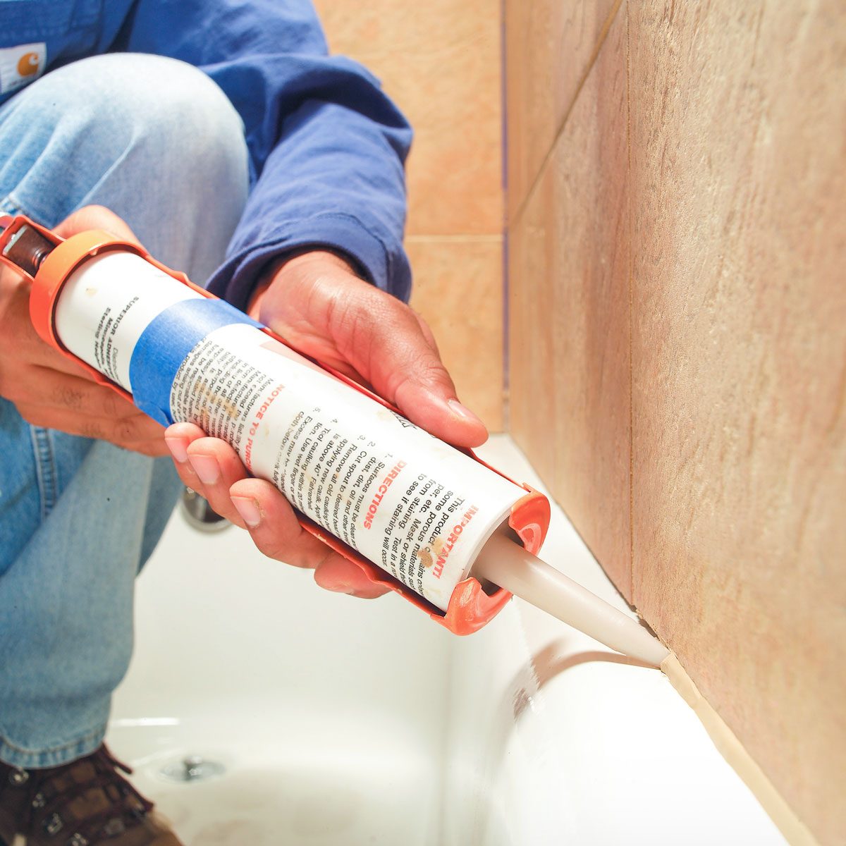 Caulking Bathtub with Caulk Gun