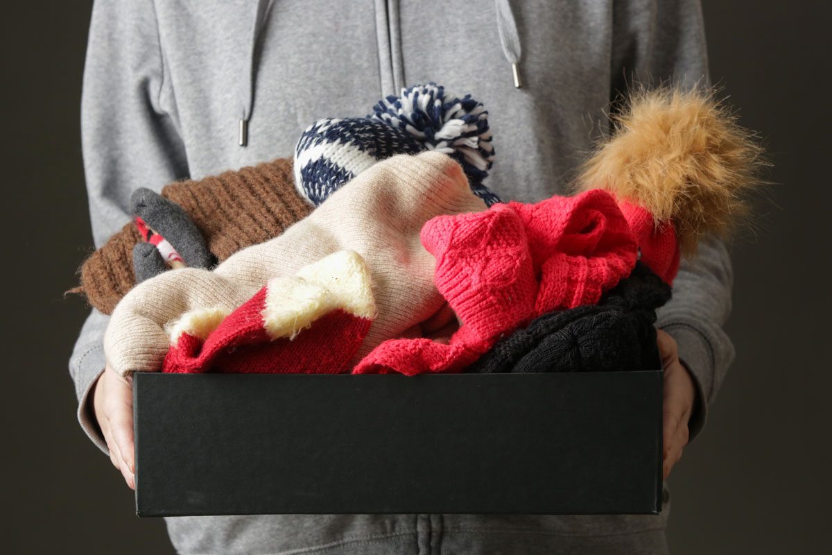 Volunteer Women Holding Donation Box With Warm Woolen Wintery Clothes, Hats, Socks, Gloves...