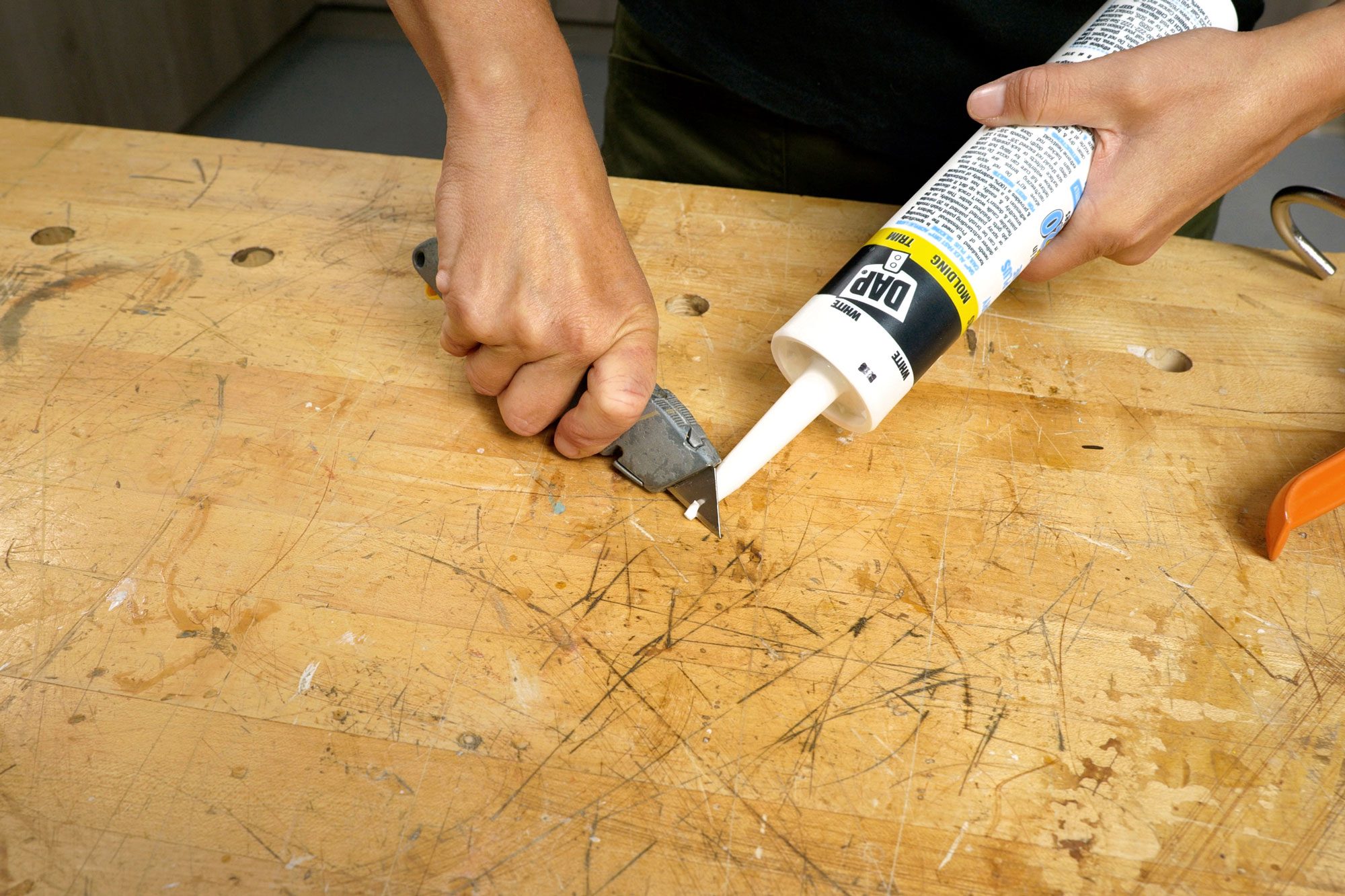 Caulk Interior Trim open the caulk tube