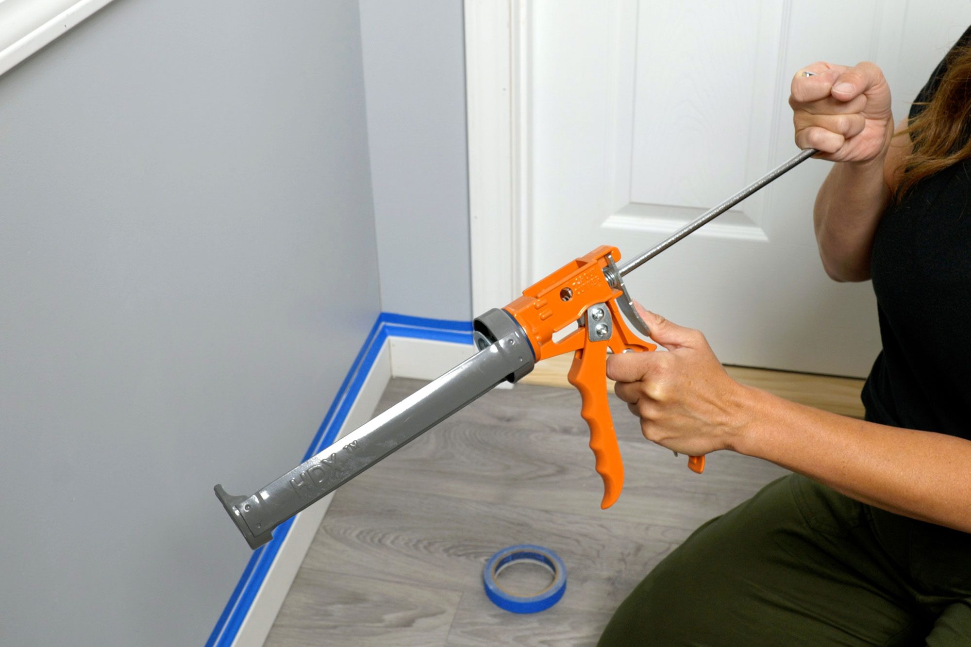 Caulk Interior Trim load caulking tube into the gun