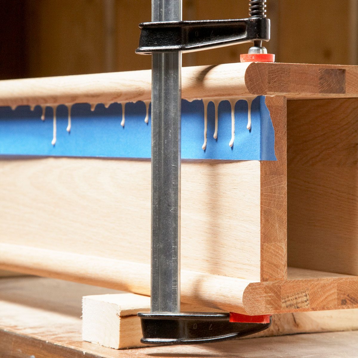 Pieces of Wood Glued and Clamped with Clamp