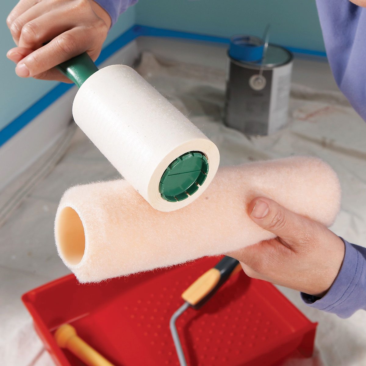Removing Lint of a Paint Roller with Lint Roller