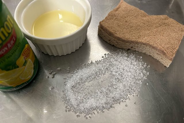 Cleaning Sink with Salt and Lemon