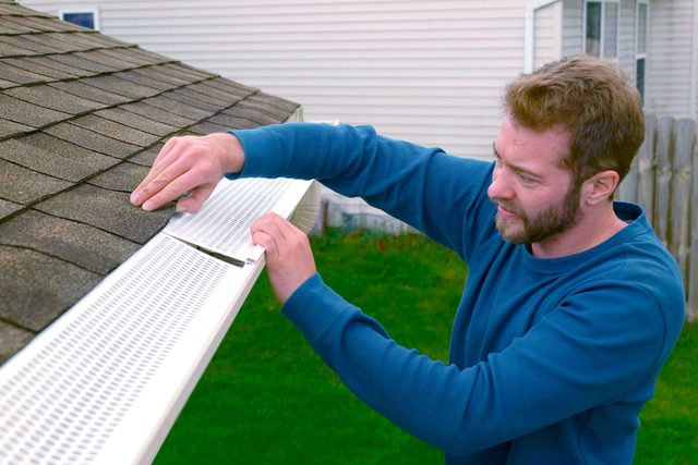 Slide gutter guard under shingle