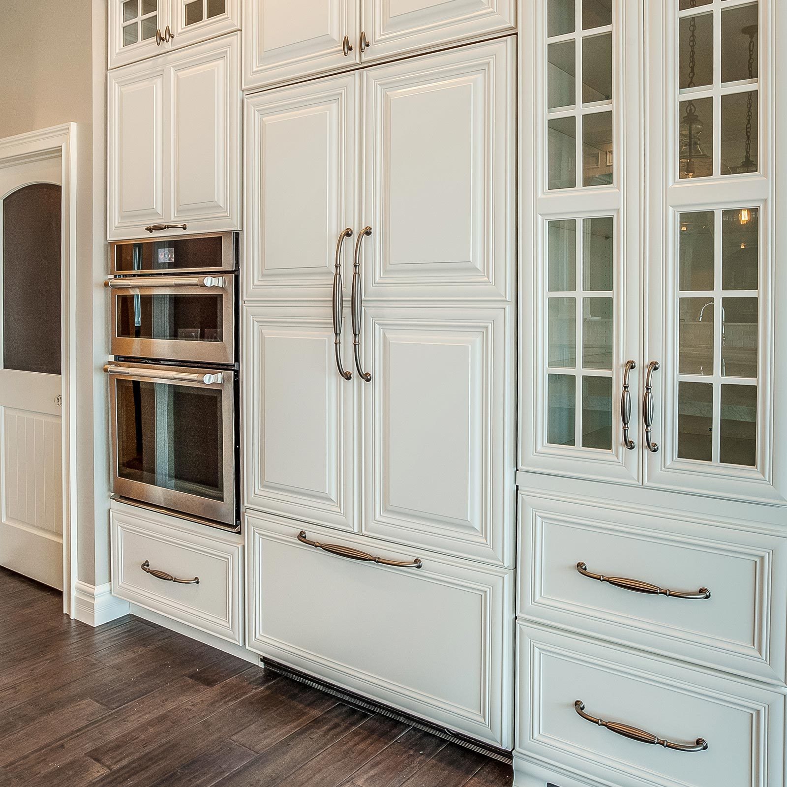 White kitchen with built in refrigerator