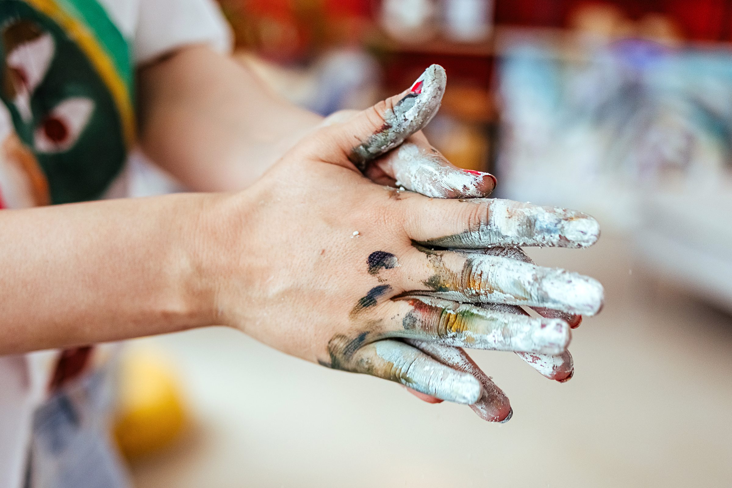 Female artist got all messy after painting with hands