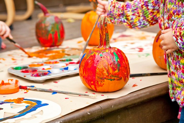 Pumpkins colorfully painted by children.