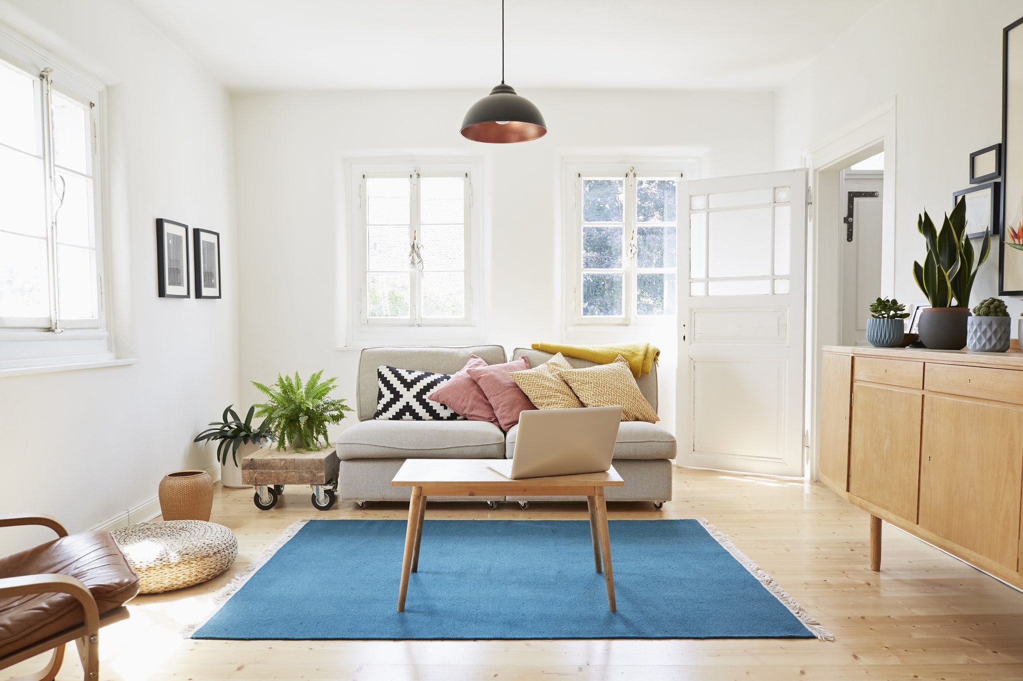 Laptop on coffee table in a modern living room of an old country house