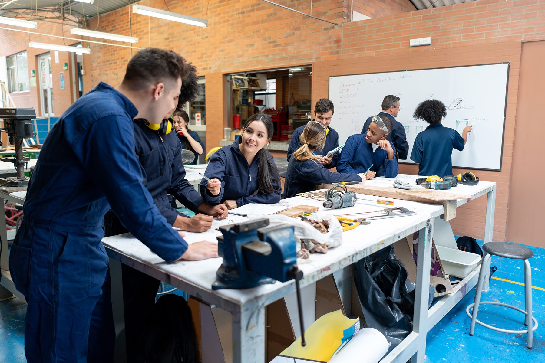 Group of students in a manufacturing class at college 