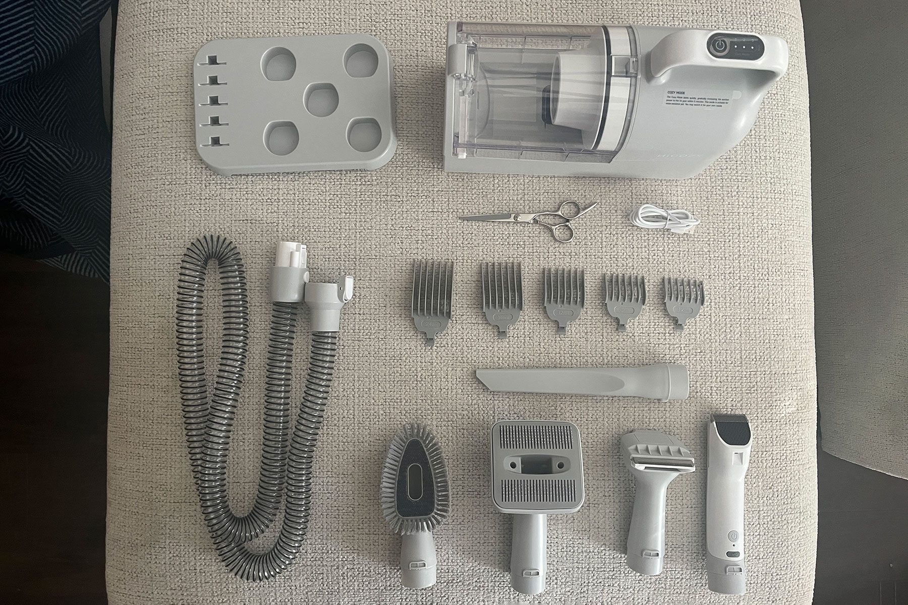 Parts of Dog brush kept on chair