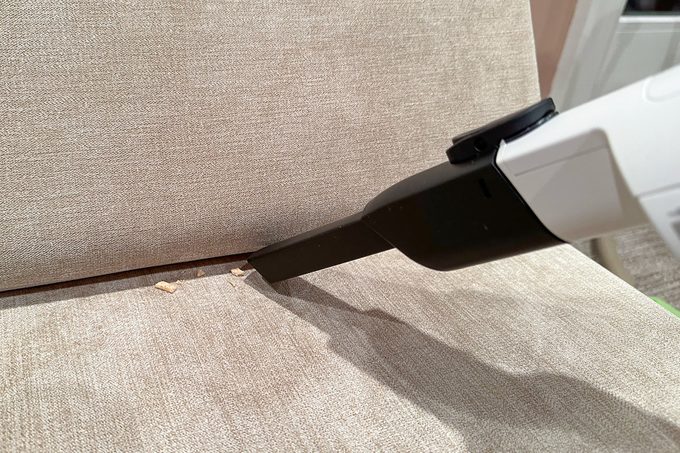 Shark Cordless Pro Vacuum used for cleaning couch