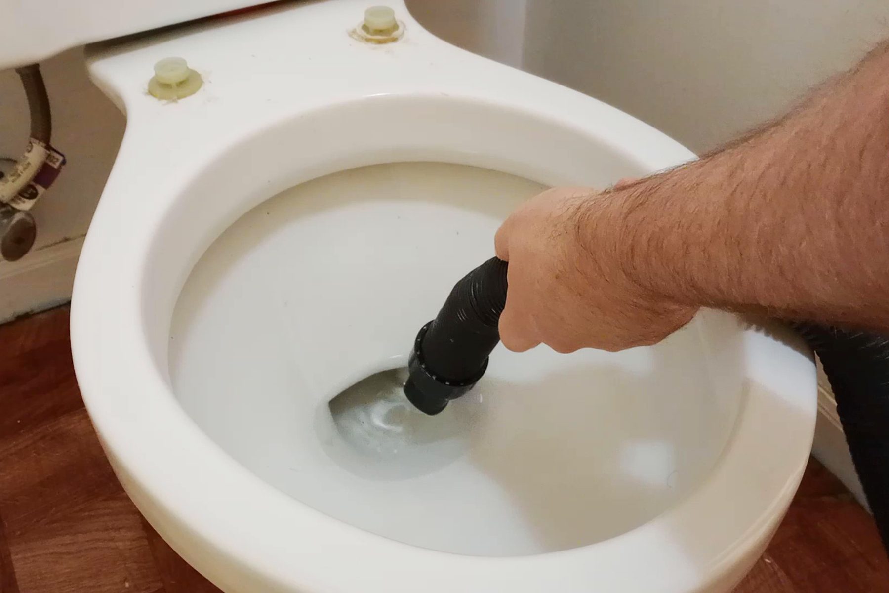 Drain water from the toilet