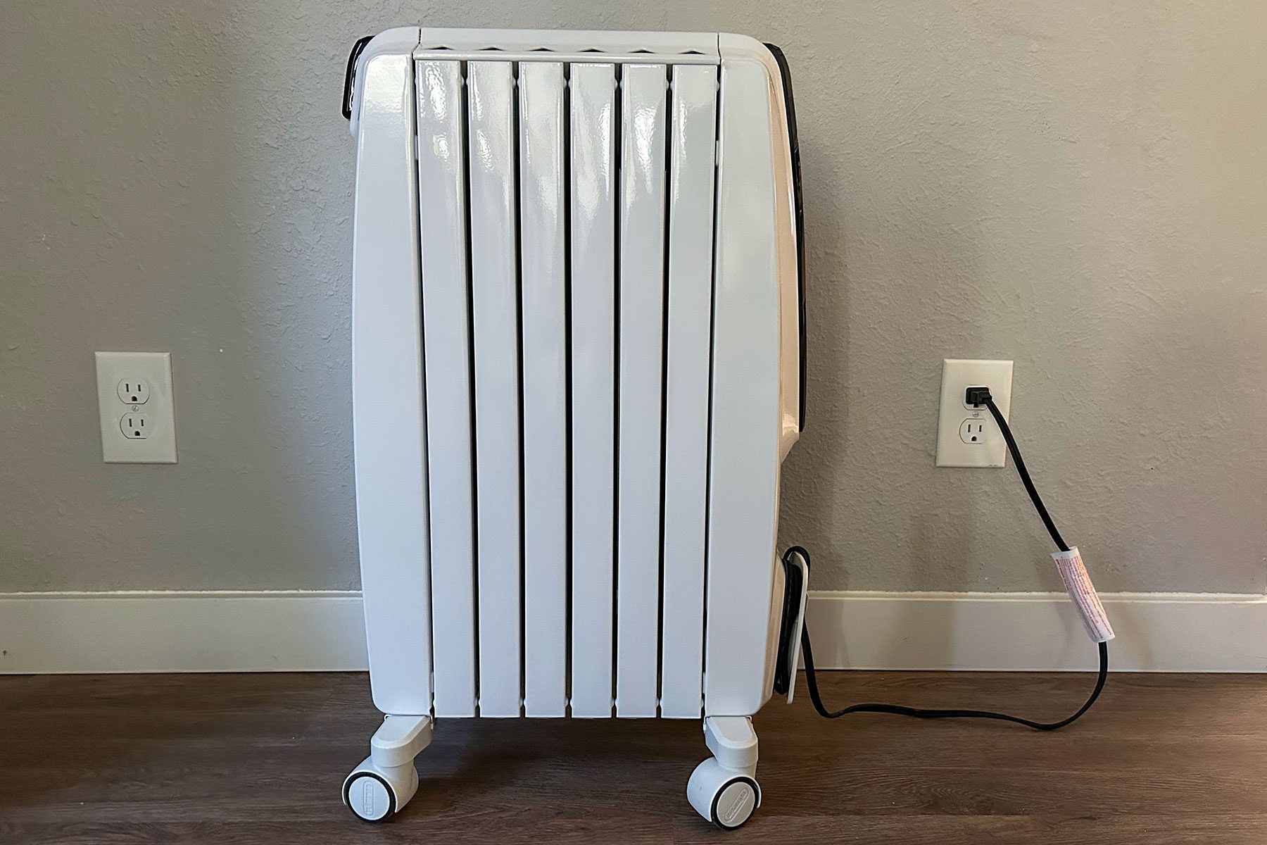 Side view of space heater on wooden floor