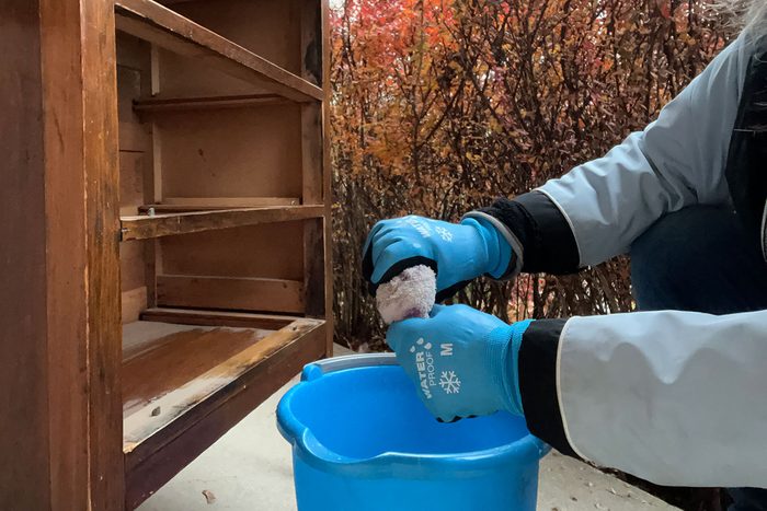 Squeezing the cloth wearing gloves