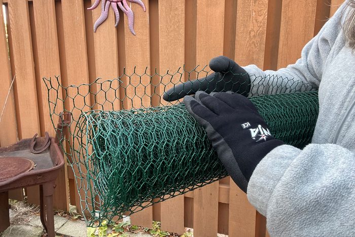 Holding wire roll while wearing gloves