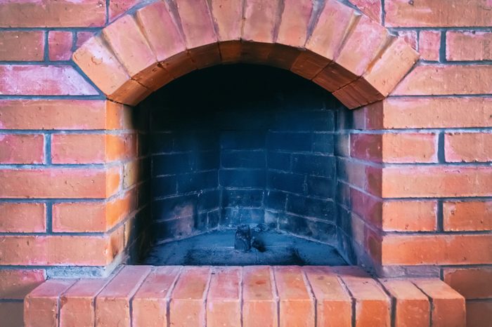 red stone brick fireplace outdoor firebox black burnt
