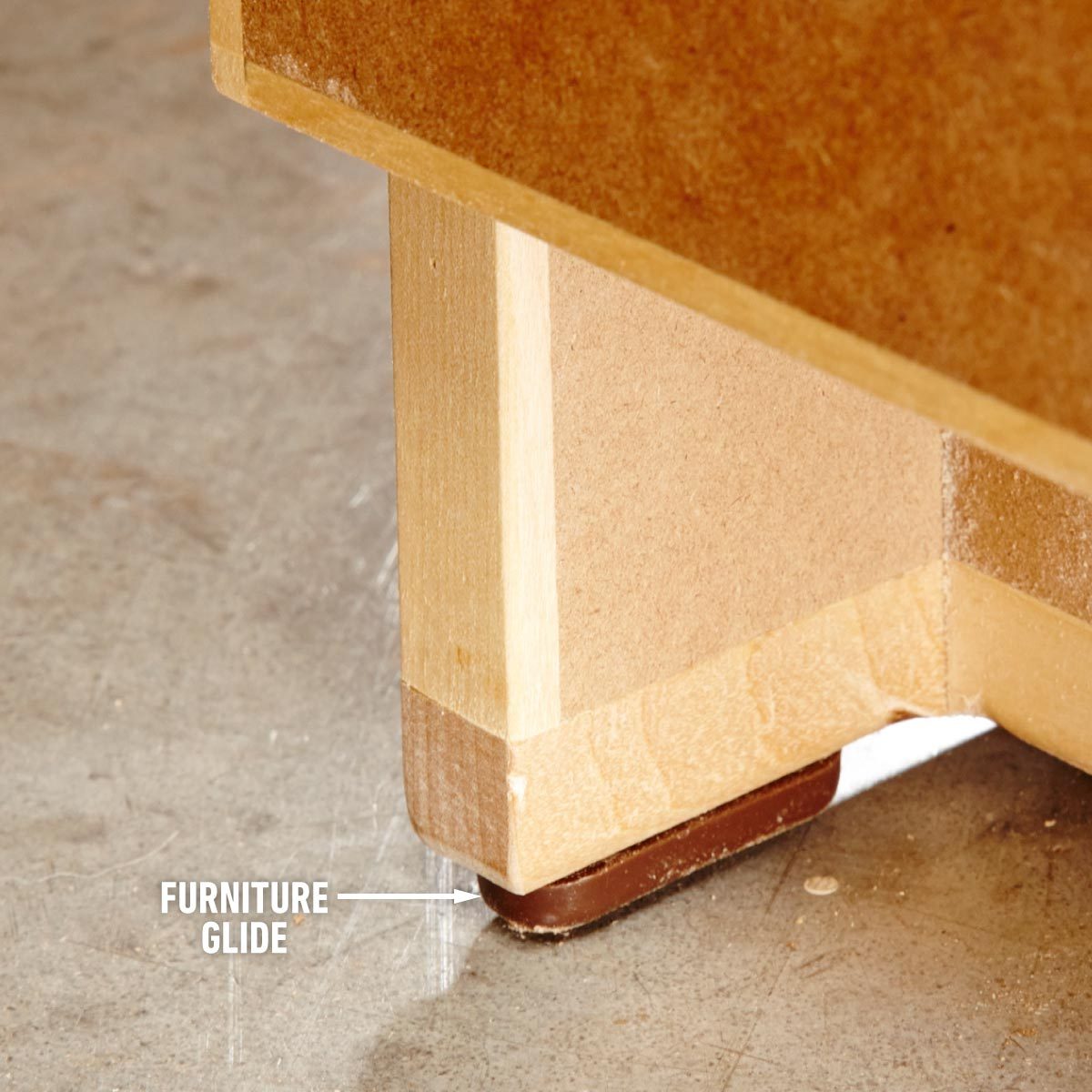 A picture of hard plastic furniture glides on wood that slide across floors.