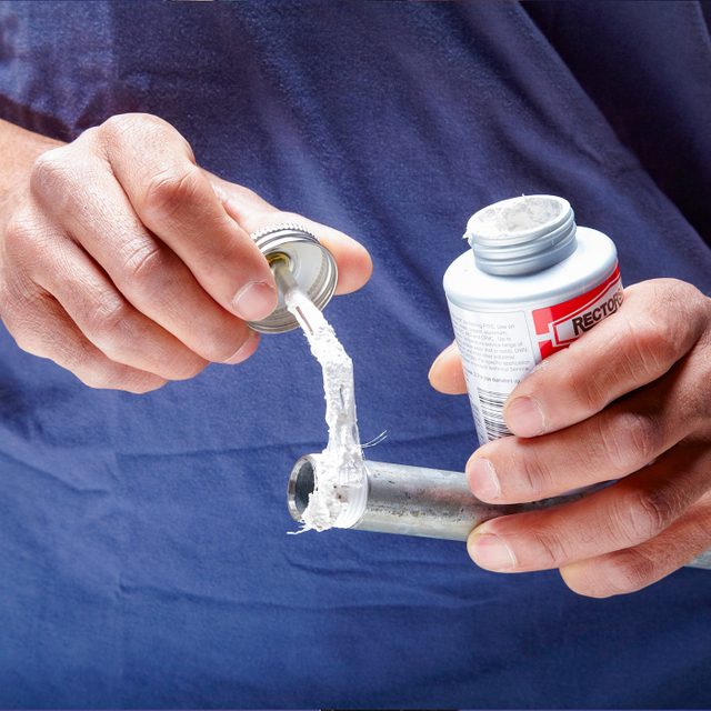 Apply pipe dope to male threads