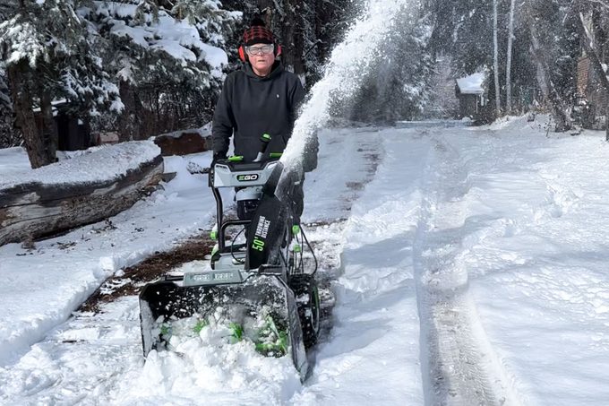 A women blowing snow with Ego Cordless Two Stage Snow BlowerPamela Bondurant/Family Handman