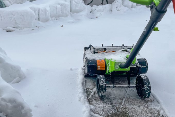 Earthwise Electric Snow Shovel cleaning the path way
