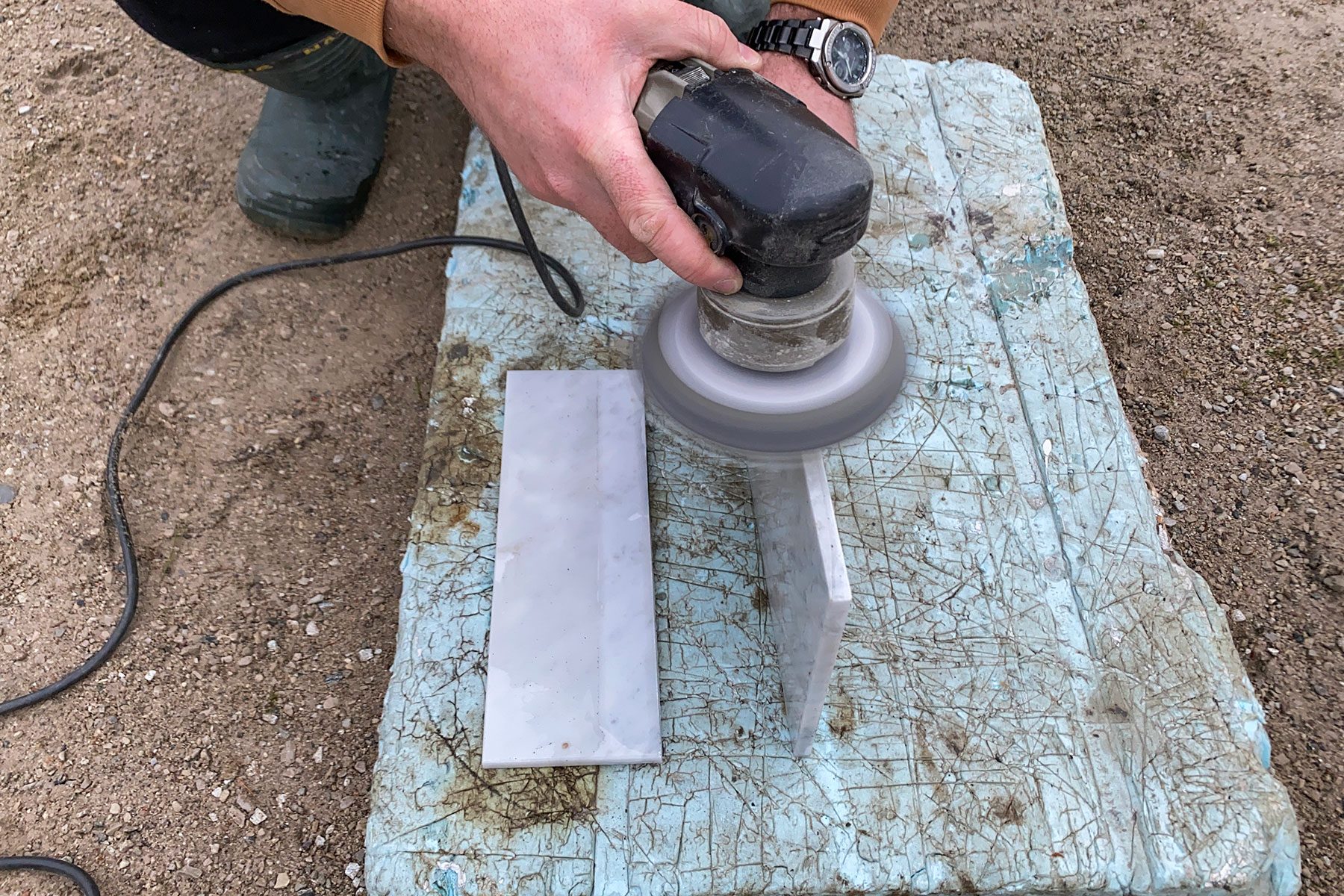 Sanding the marble half with orbit sander