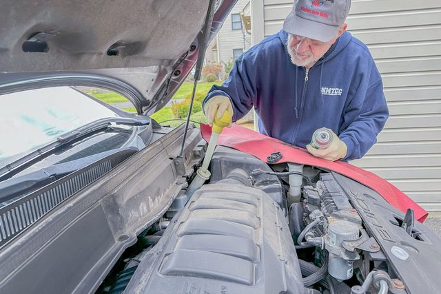 Using A Baster To Suck Fluid Out Of The Master Cylinder