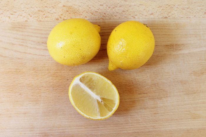 Lemons on a rustic wood background