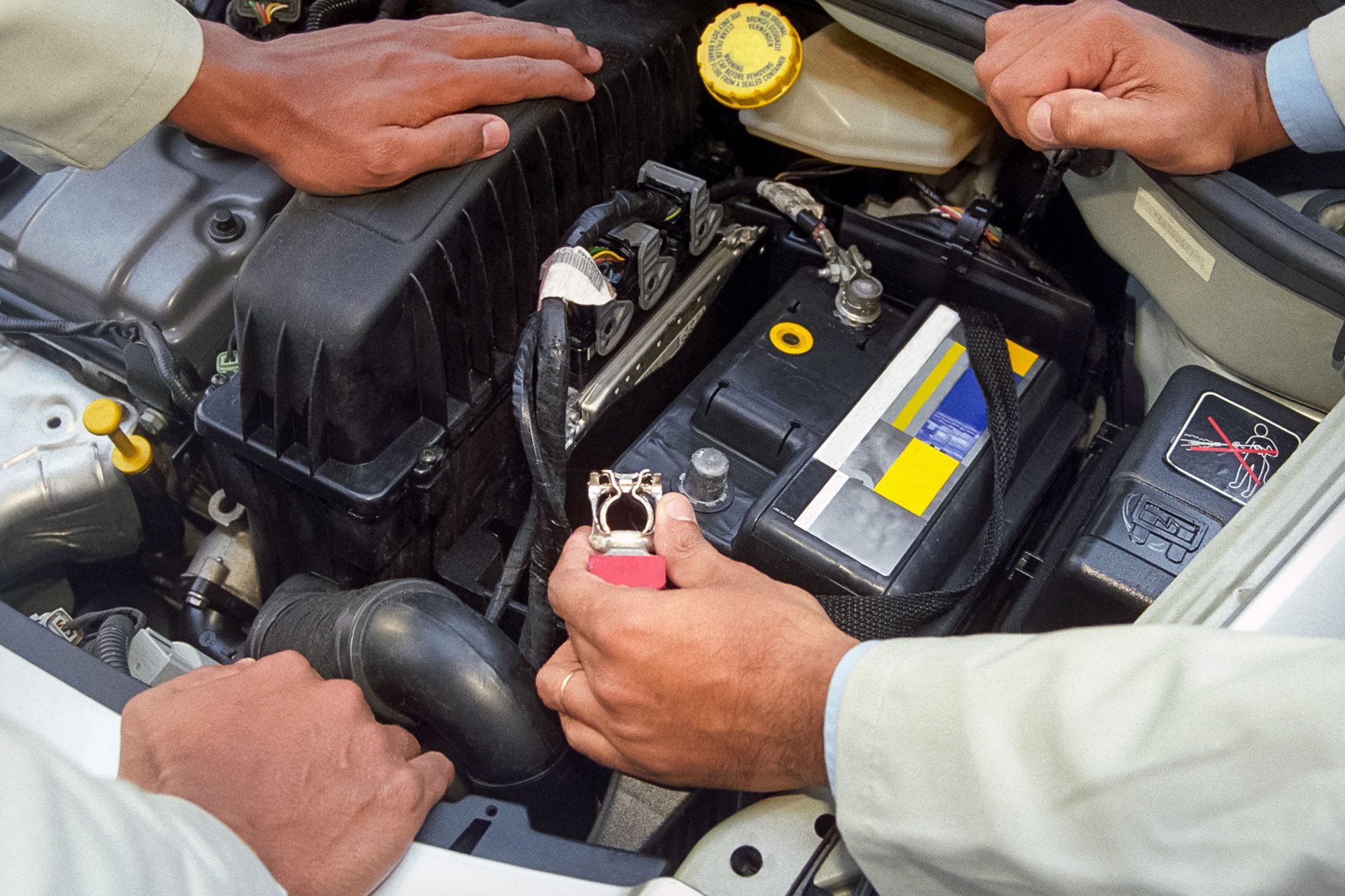 Mechanic Installing Battery Terminal