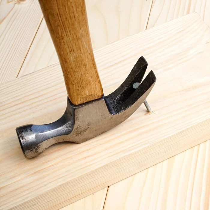 Pulling out a nail by hammer that won't budge