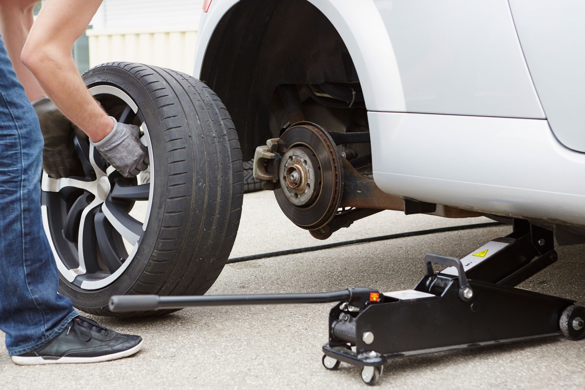 A Man Changing Car Tire