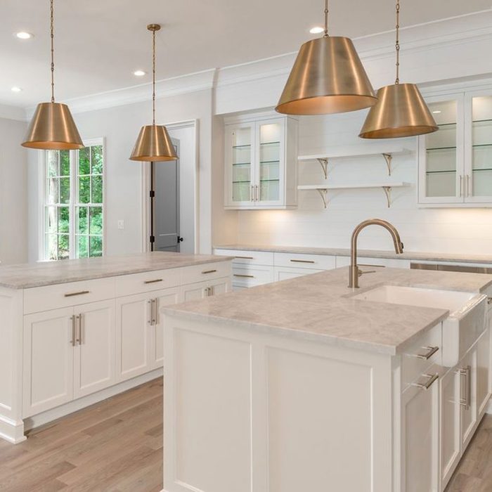 Modern Double Island Kitchen with large windows and lamps